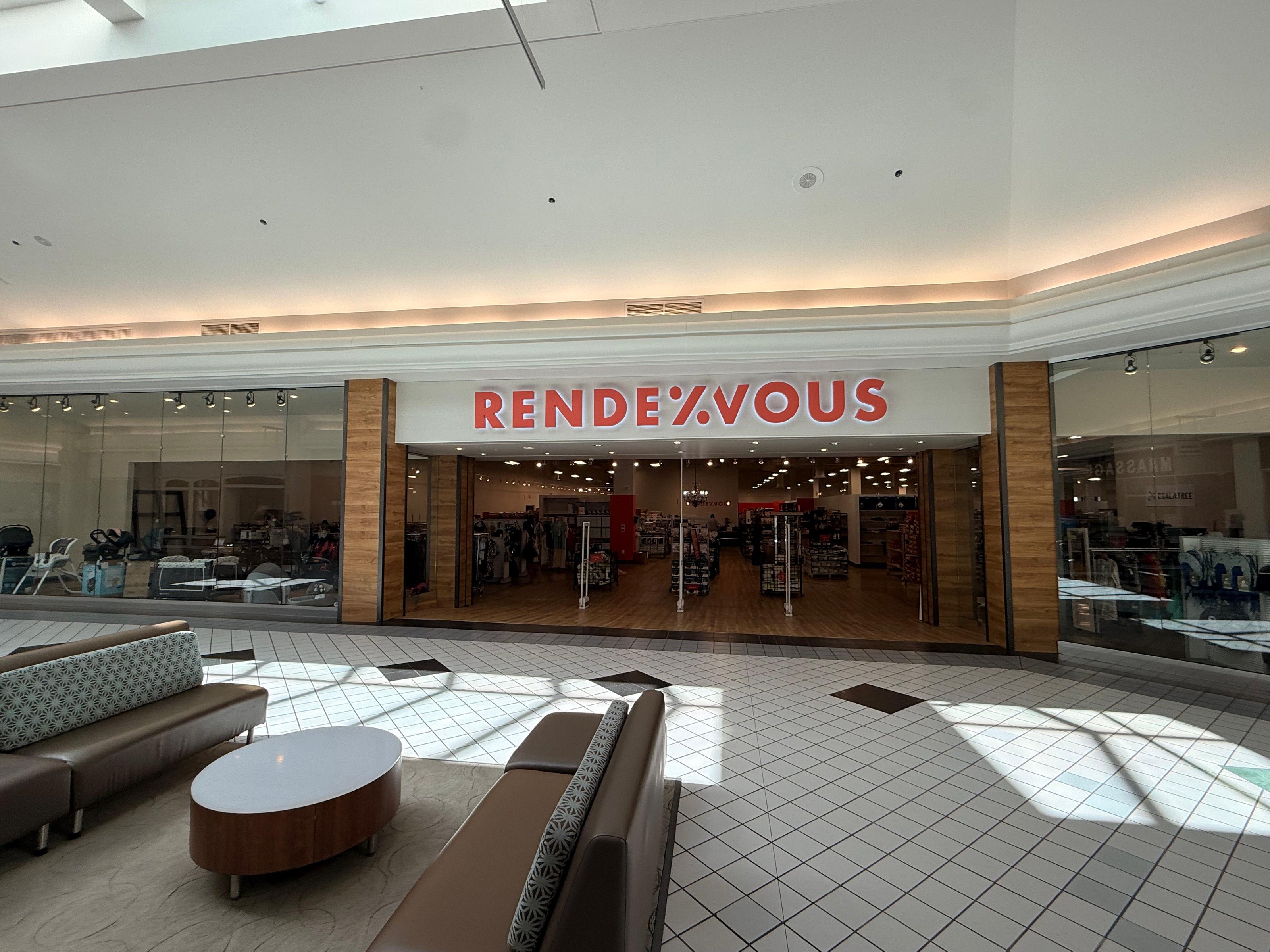 Mall interior with 'Rendezvous' store entrance