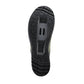 Close-up of a black shoe sole with tread pattern on a white background